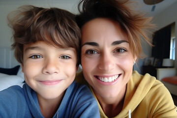 Head shot portrait mother with son taking selfie together close up