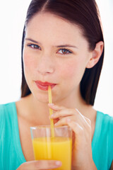 Health, drink and portrait of woman with juice for nutrition, wellness and hydration in studio. Happy, thirsty and face of person with fruit blend for vitamins, detox and diet on white background