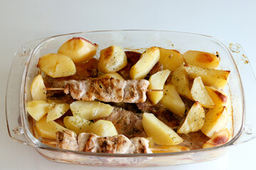 View from Above of Potatoes and Grilled Meat in Glass Dish