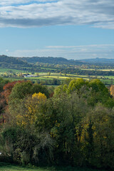 Vista from Burton Dassett Hills on a bright autumnal day with far reaching views over Warwickshire, England - 674727786