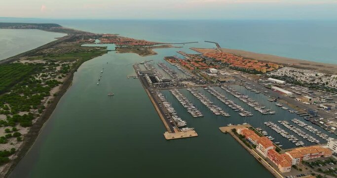 Aerial view of port leucate with mediterranean sea in background, sunset France. Port Leucate aerial view leisure boats marina vacation seaside resort France sunny day