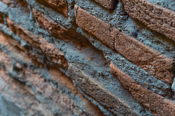 Brick wall, texture of red stone blocks closeup