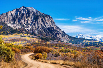 Dirt Road in the Autumn in the Mountains
