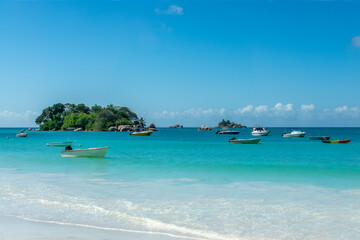 Fototapeta na wymiar Boats at Anse Lazio, scenic beach in Praslin island, Seychelles