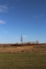 A power line tower in a field