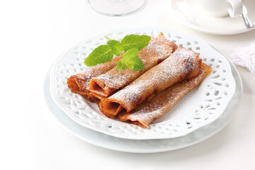 Crepes prepared with walnut flour, light background, top view.