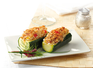 Zucchini stuffed with cooked rice and vegetables with crunchy breadcrumbs
