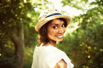 Portrait, walking or happy woman in park, countryside or natural environment to relax in summer. Nature, wellness or person in garden for peace or fresh air on an outdoor holiday vacation in forest