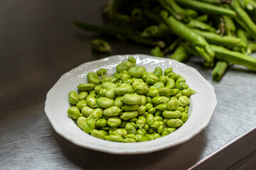 The dish with a green broad beans