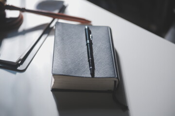 Business and lawyers discussing contract papers with brass scale on desk in office. Law, legal services, advice, justice and law concept picture with film grain effect