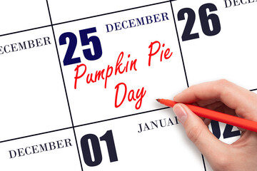 December 25. Hand writing text Pumpkin Pie Day on calendar date. Save the date.
