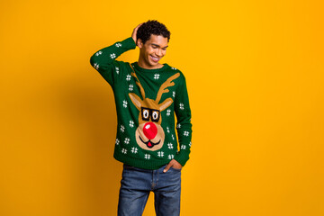 Photo of positive good mood guy girl dressed christmas ugly print pullover hand head empty space isolated yellow color background