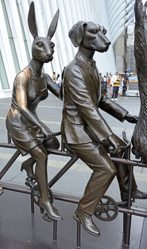 Dogman and Rabbitwoman on bicycle (fragment) on street of New York City, USA