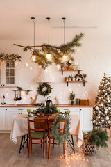 Modern Kitchen Interior with Island, Sink, Cabinets in New Luxury Home Decorated in Christmas Style.