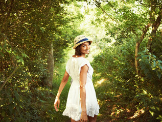 Portrait, walking or happy woman in park, nature or woods environment to relax in summer. Countryside, wellness or person in garden for peace or fresh air on an outdoor holiday vacation in forest