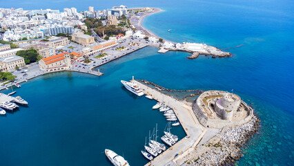 Mandraki port of Rhodes city harbor and Elli beach a popular summer tourist destination, aerial...