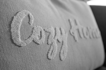 interior design: gray cushion with the inscription cozy home