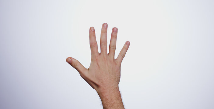 Hand, counting five and person in studio with mockup space for advertising, promotion or marketing. Fingers stop, hold up closeup and man model with mathematics numbers gesture for empty mock up by w