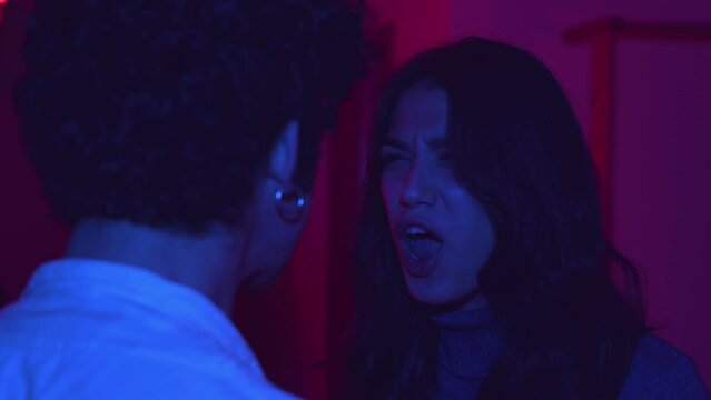 back and forth - young couple argues furiously screaming and accusing each other