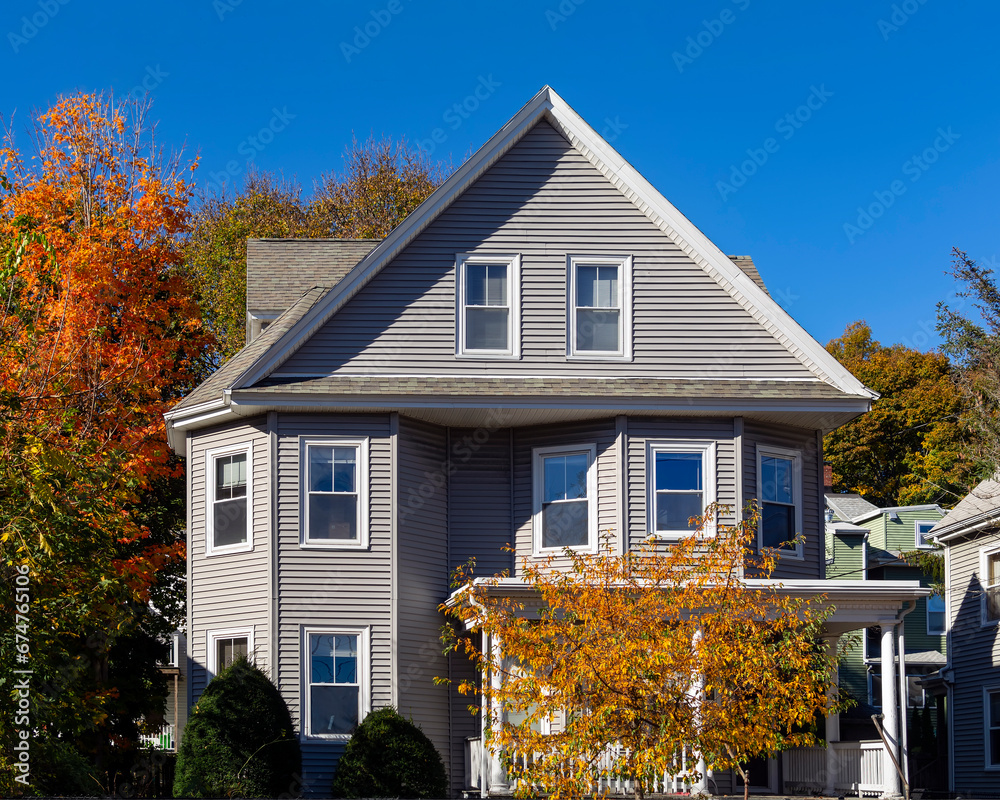 Wall mural Single family home facade on an autumn day, Brighton, Massachusetts, USA