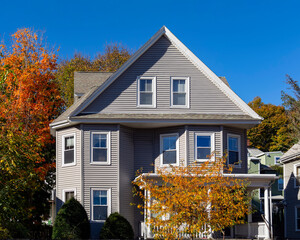 Single family home facade on an autumn day, Brighton, Massachusetts, USA