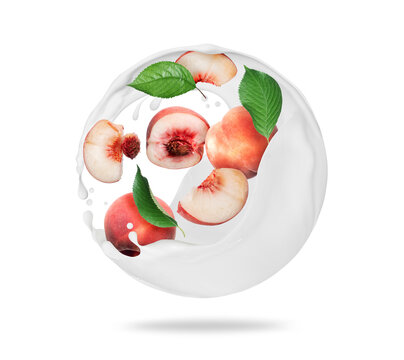 Whole and sliced peaches in spherical milk splashes on a white background