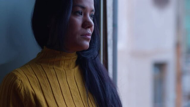 sadness, nostalgia - indian girl about to cry thinks about her distant family 