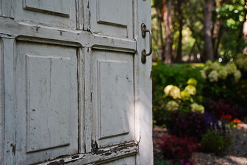 White wooden door in the garden area.