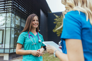 Nurses walking and talking. Diversity workers, smile and happy medical healthcare teamwork on...