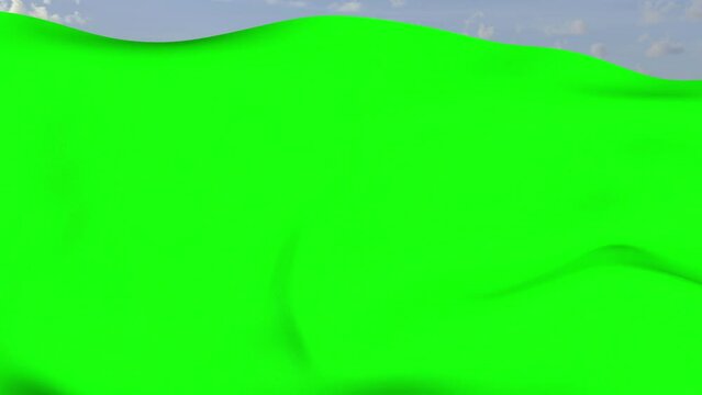 Loop der gr&uuml;ne Fahne wehend im Wind als Nahaufnahme 4K