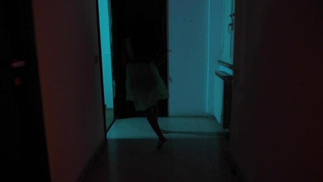 fear, danger - indian girl runs down the hall feeling she is in danger