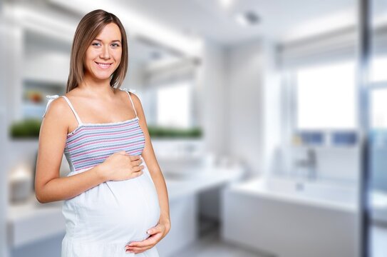 Happy smiling pregnant woman at home, AI generated image