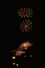 New Year's Night, Diwali, bonfire night Colourful Starbursts and Rocket Explosions on Black Background Sky with Red, Green, Blue, Purple, Gold Colour Fireworks Bursts with Space for Text-Smoke-free