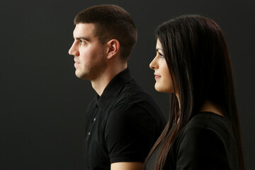 Studio portrait of young couple on the black background