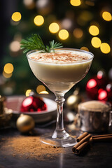 Classic Holiday Tradition, festive glass filled with creamy egg nog, garnished with a sprinkle of nutmeg and a cinnamon stick, Christmas tree and twinkling fairy lights.