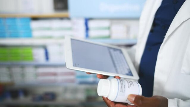 Tablet, search and hands of pharmacist with medicine box for information, stock or inspection. Pharma, retail and closeup of male doctor with app for prescription check, inventory or store management