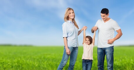 Happy young parents and child walking