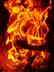 Close up shot of burning firewood in the fireplace