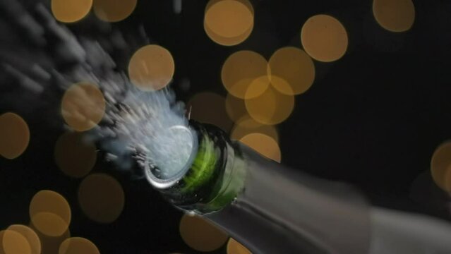 Champagne opening with lights bokeh background slow motion vertical