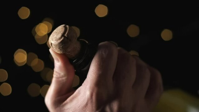 Champagne opening with lights bokeh background slow motion vertical