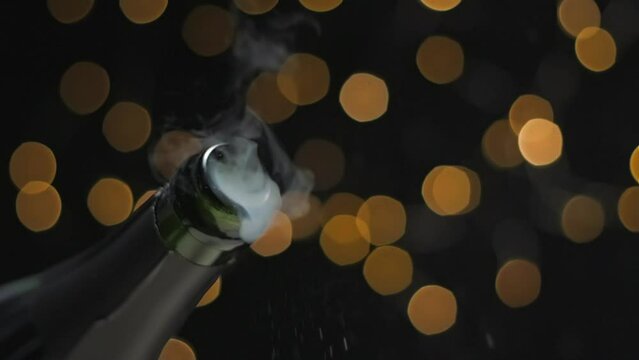 Champagne opening with lights bokeh background slow motion