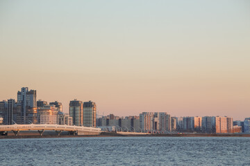 Fototapeta premium Architecture of the city skyline on the seashore at sunset