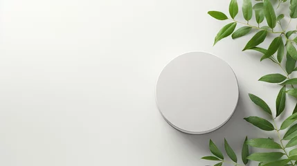 Fotobehang Empty round podium and green leaves on light grey background top view. Pedestal and fresh natural branches for cosmetic marketing. Eco product presentation or sale mockup. Top view. Minimal flat lay. © HN Works