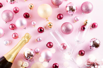 Christmas party with champagne on pink background