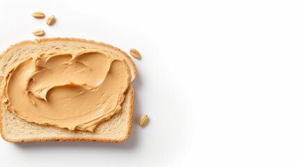 Knife spreading peanut butter on toast bread