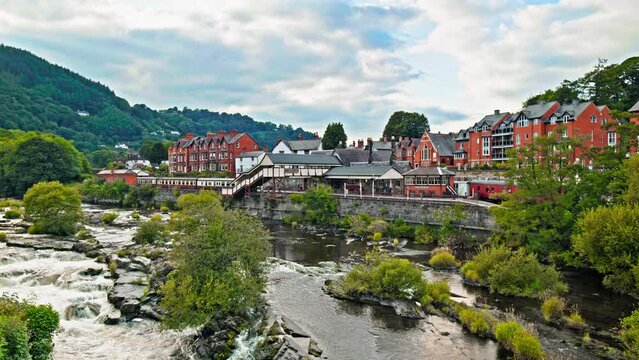 Llangollen Railway Station River Dee Llangollen Denbighshire North Wales. Colorful houses in Llangollen town and River Dee, in Denbighshire, Wales.