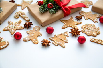 Christmas background, holiday mood. Christmas gifts, gingerbread cookies, Christmas balls on a...