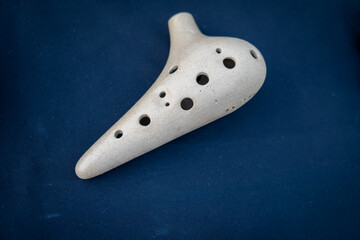 Ocarina on display, a traditional wind musical instrument, close-up with selective focus