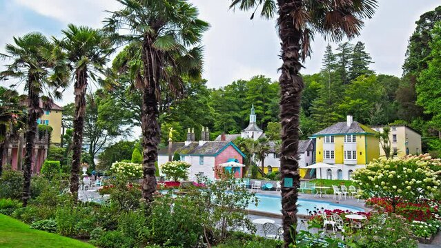 Panoramic view of the central piazza in Portmeirion, Wales. Colourful houses and swimming pool in baroque style tourist village in Gwynedd, North Wales.