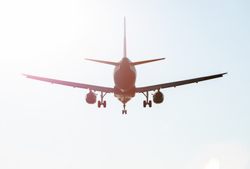 Back of flying Plane in the sky